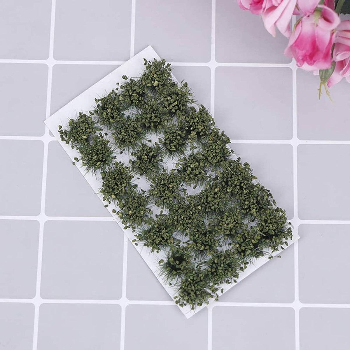 Green shrub tuft cluster on a white square backing sheet for terrain modeling