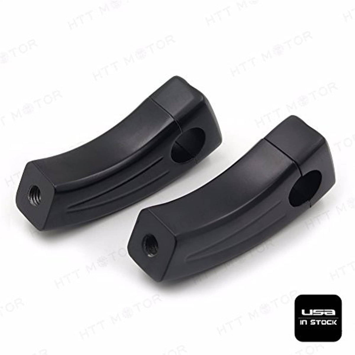 Black handlebar riser block pair with round opening and front sculpted channel details