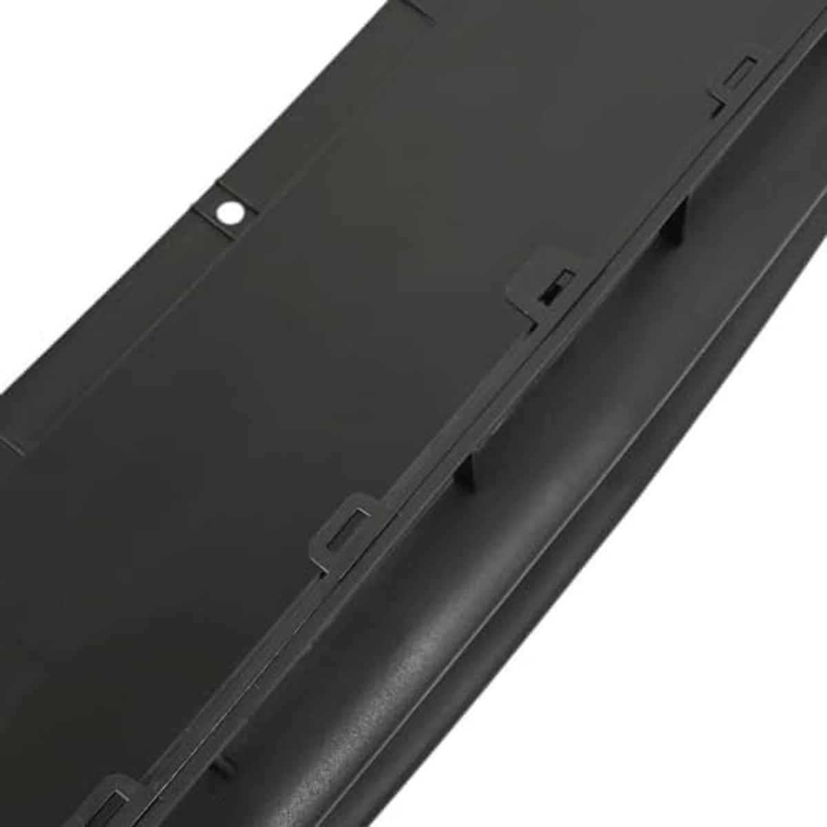 Front bumper grille panel detail, black plastic with raised channels and clips