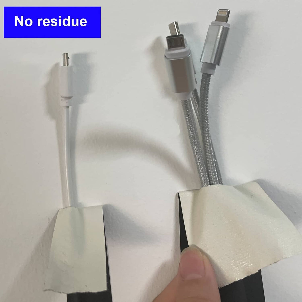 Pair of black gaffer tape strips with no-residue style adhesive backing visible