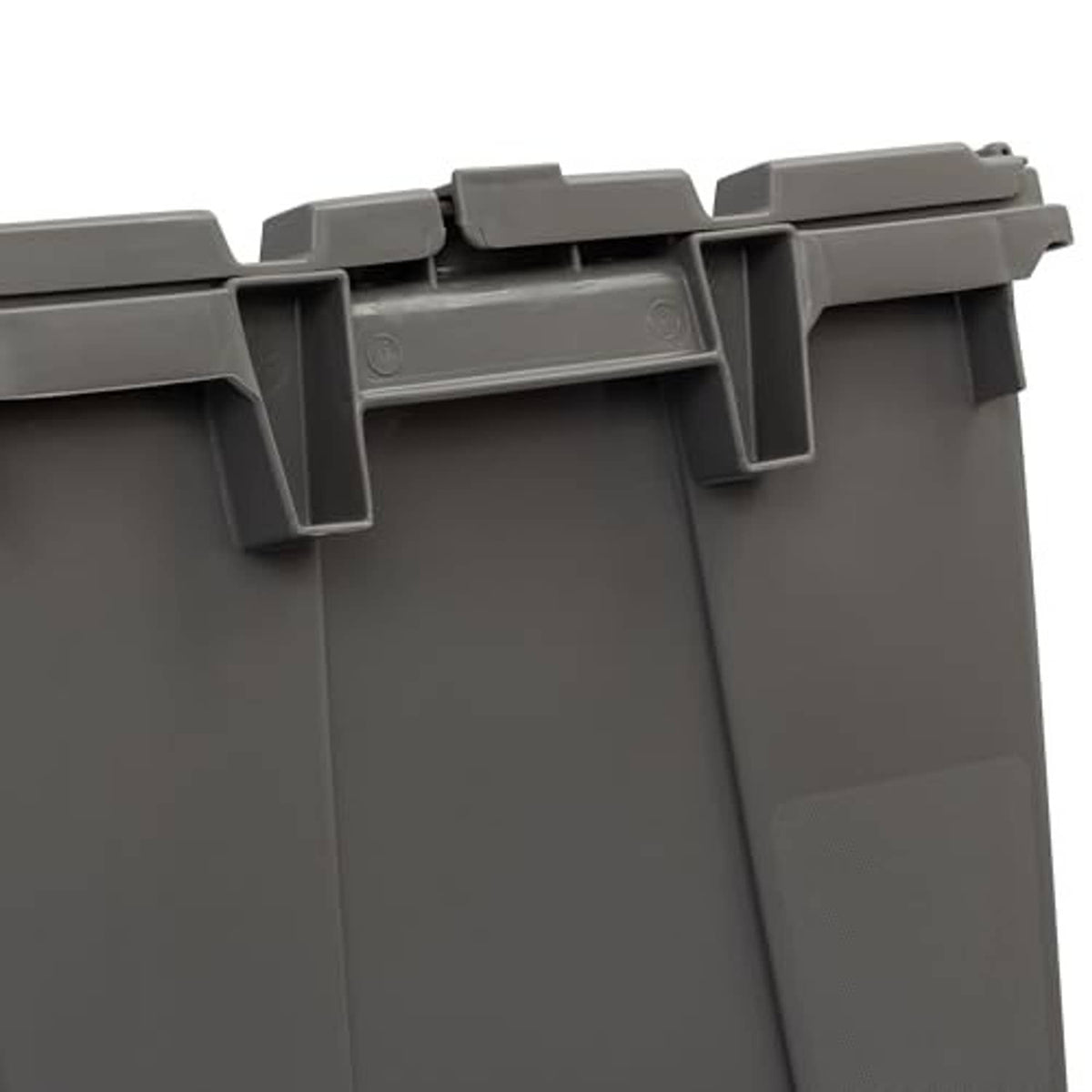 Close-up of grey plastic storage container lid latch on top edge