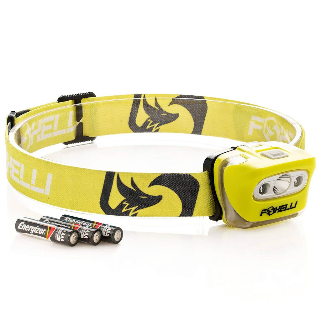 Neon yellow headlamp with patterned fabric strap and front LED module, close-up