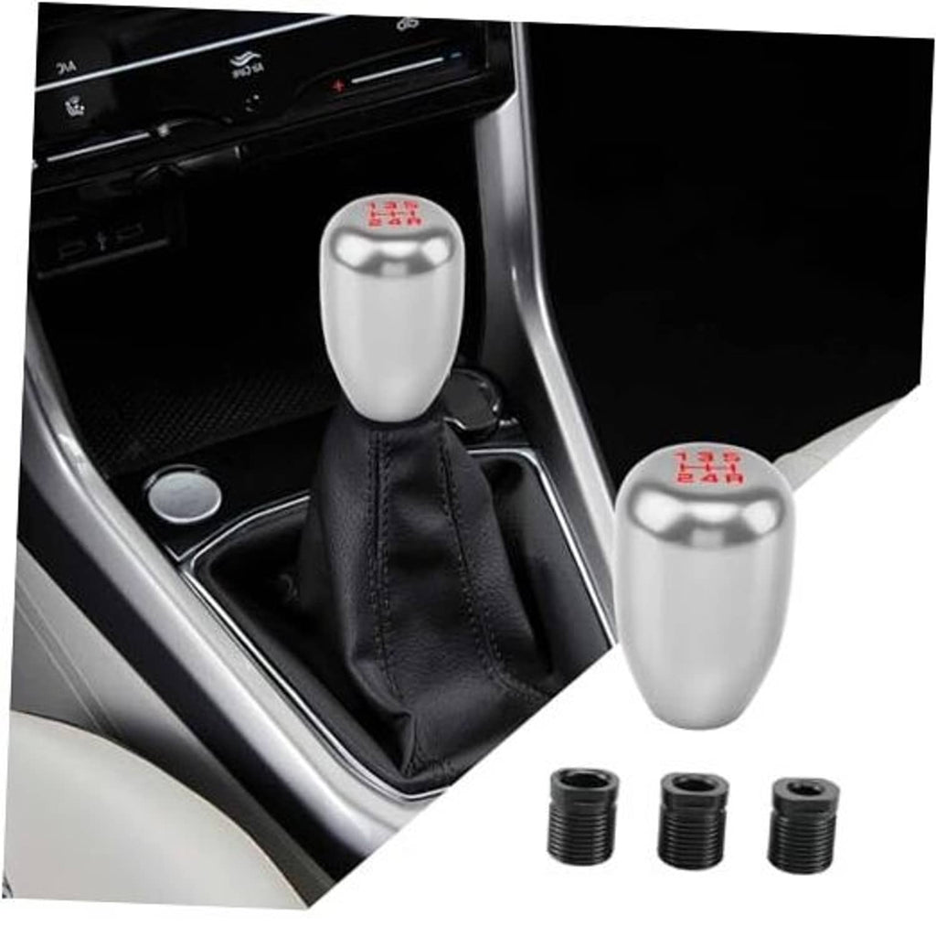 Silver gear shift knob with black leather boot and three threaded adapters