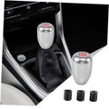 Silver gear shift knob with black leather boot and three threaded adapters