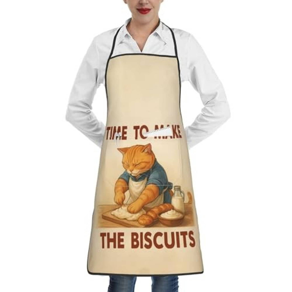 Beige chef bib apron worn over white shirt; cat baking graphic centered