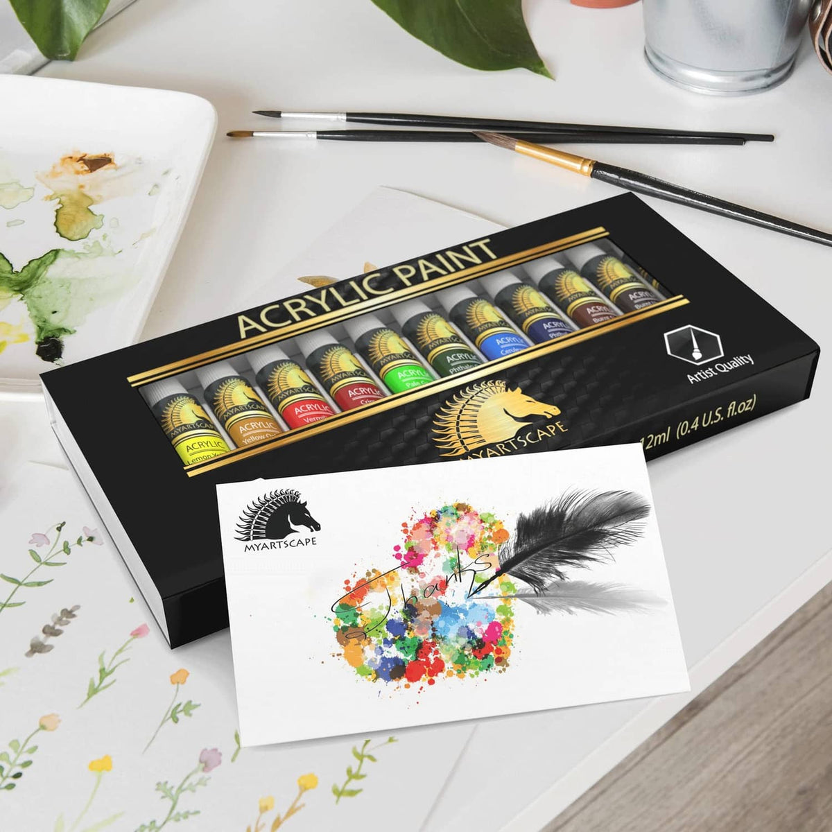 Acrylic paint set box with 12 tubes and watercolor-style artwork sheet