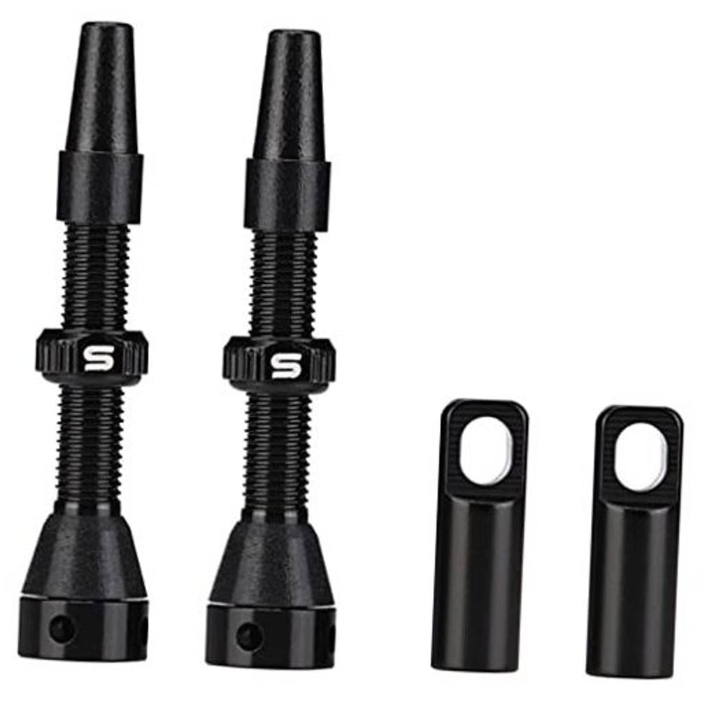 Black tubeless valve stems with rubber base and hex nut, plus two protective caps