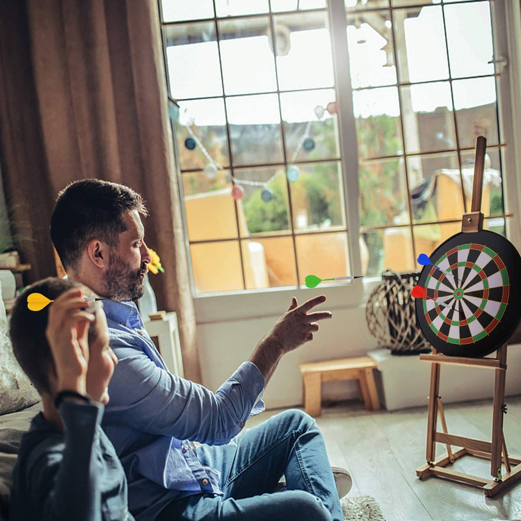 Soft tip dart in play as a player aims at a dartboard