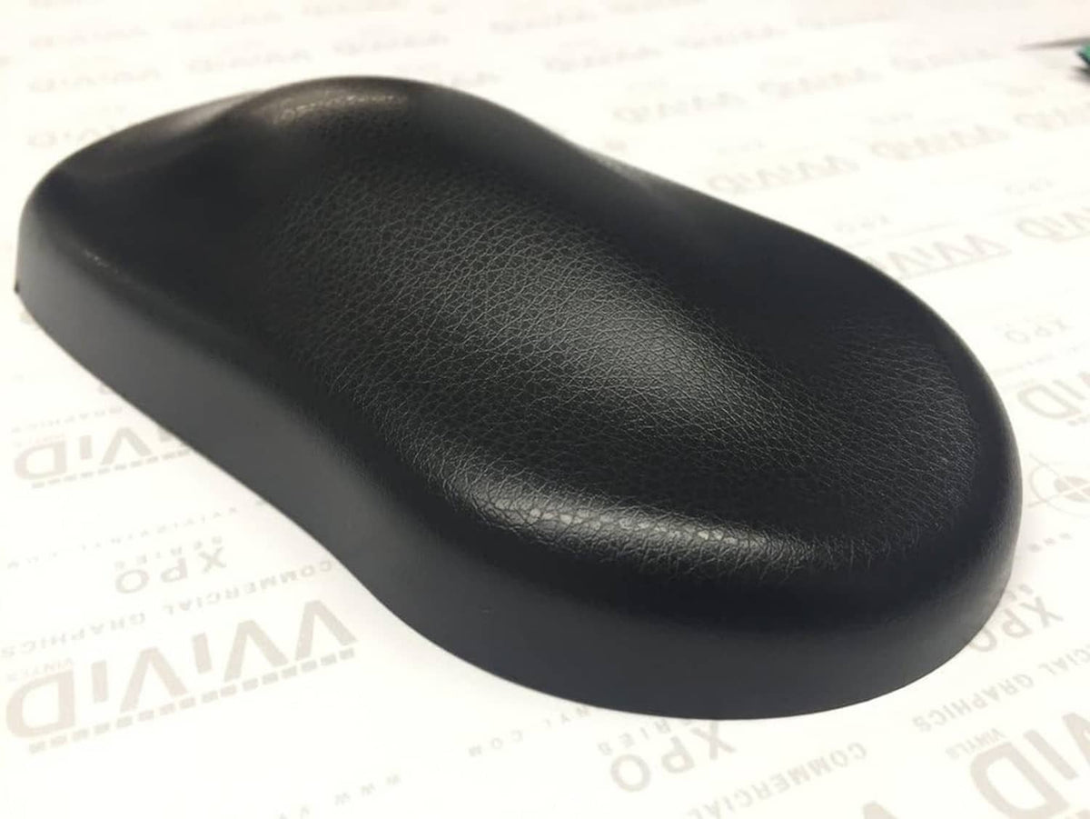 Black leather-grain adhesive vinyl sample with curved, padded look