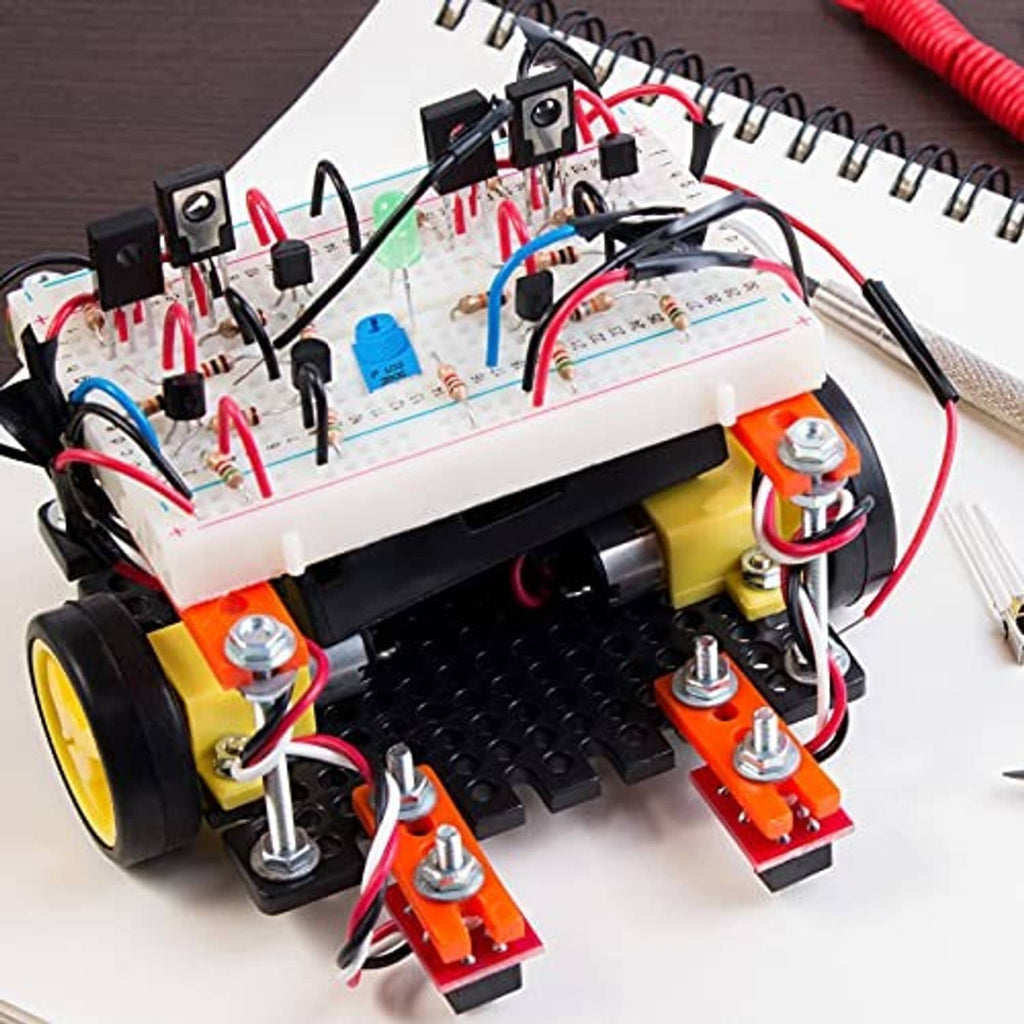 Blue potentiometer mounted on electronics board with attached leads