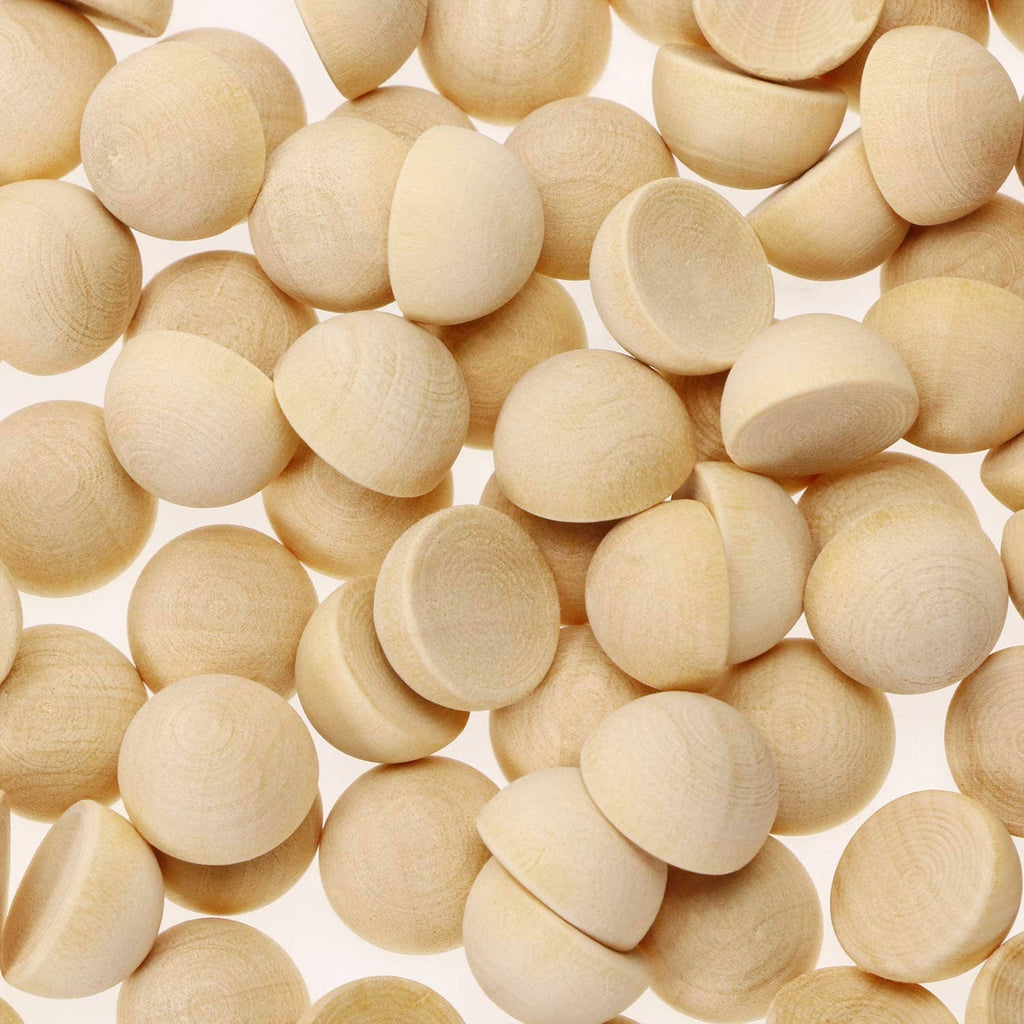Unfinished light wood half-round balls, smooth split wooden discs, close-up pile