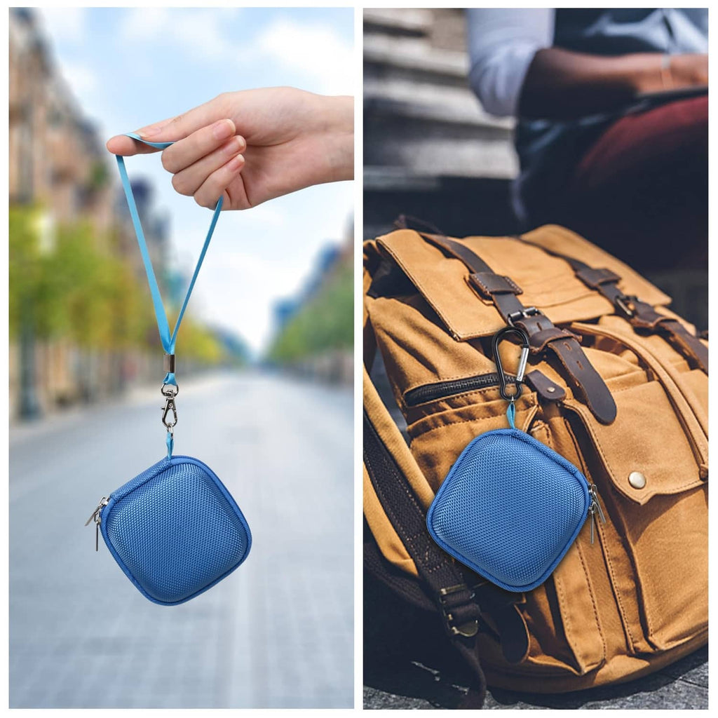 Blue compact SSD case clipped to a strap for travel and storage