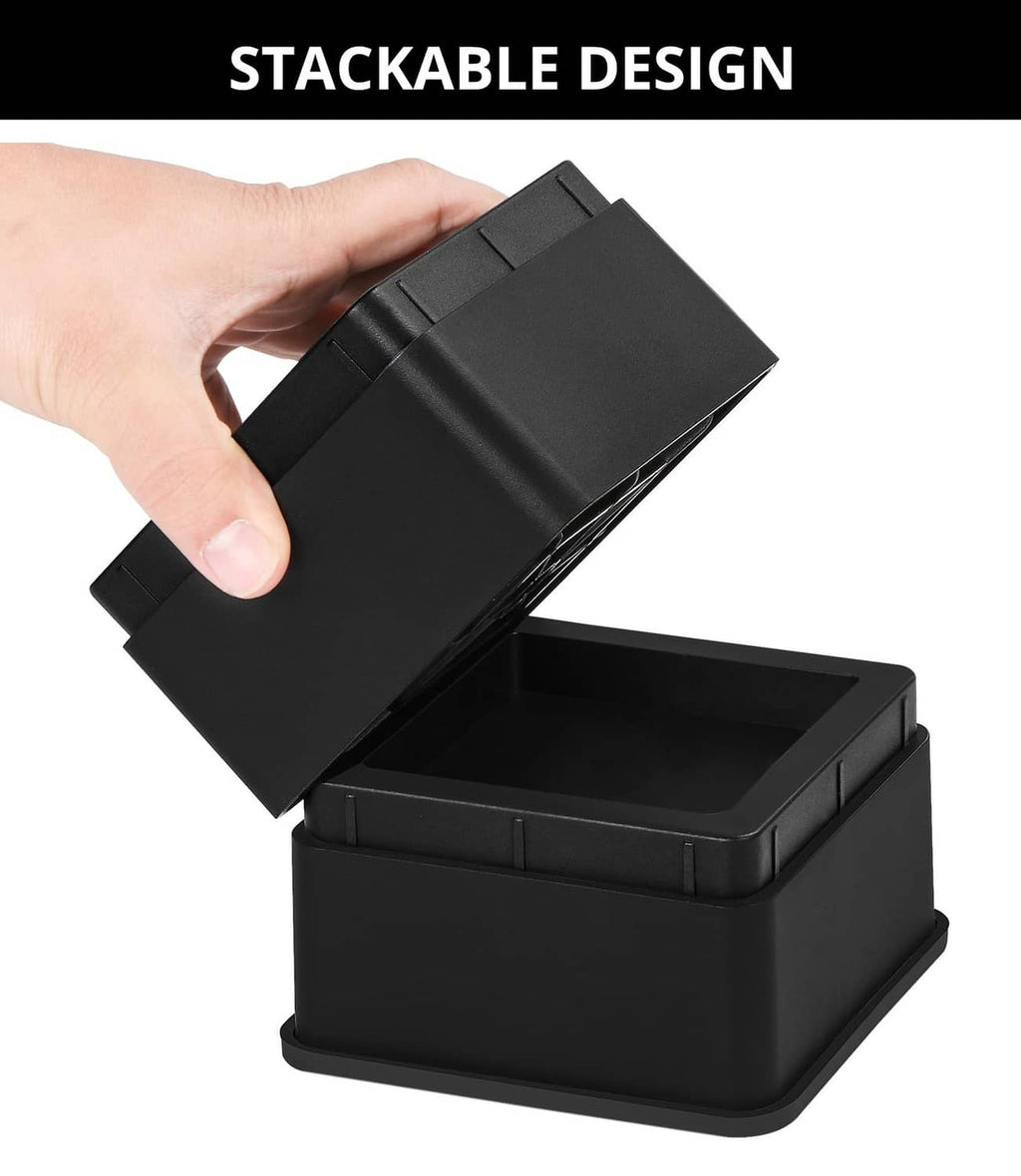 Stackable black bed riser with removable top lid held in hand