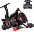 Black and red spinning fishing reel with star drag knob and extended handle