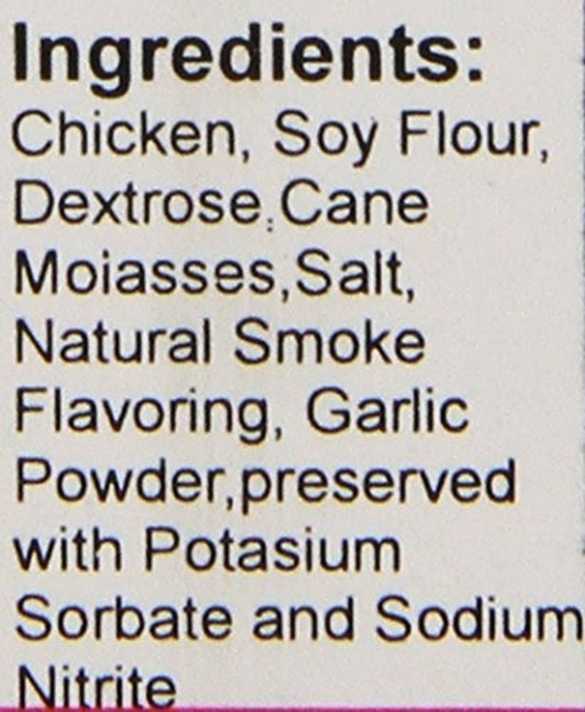 Dog treat label close-up: ingredients include chicken, soy flour, garlic powder