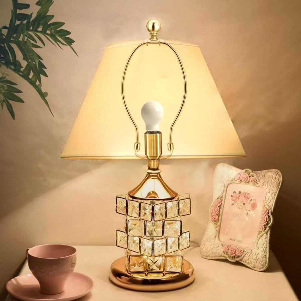 Polished brass lamp harp holder with circular top knob and curved metal frame