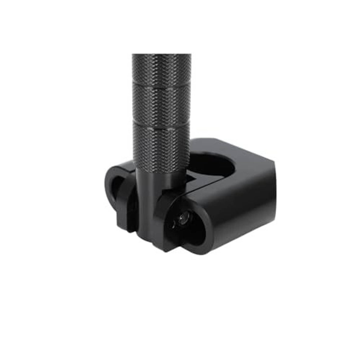 Close-up of black textured footpeg with round pivot mount opening