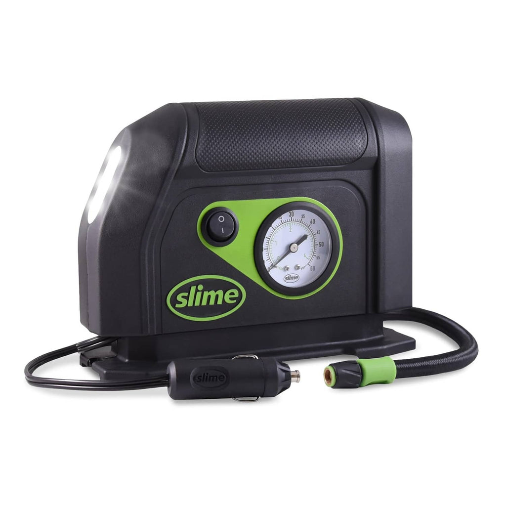 Portable tire inflator with analog pressure gauge, LED light, and air hose