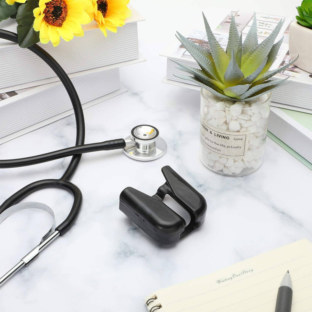 Black plastic stethoscope holder clip with snap cradle, shown with stethoscope