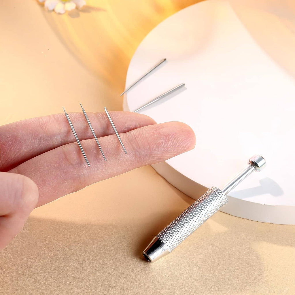 Stainless steel piercing ball grabber tool with textured grip and taper prongs