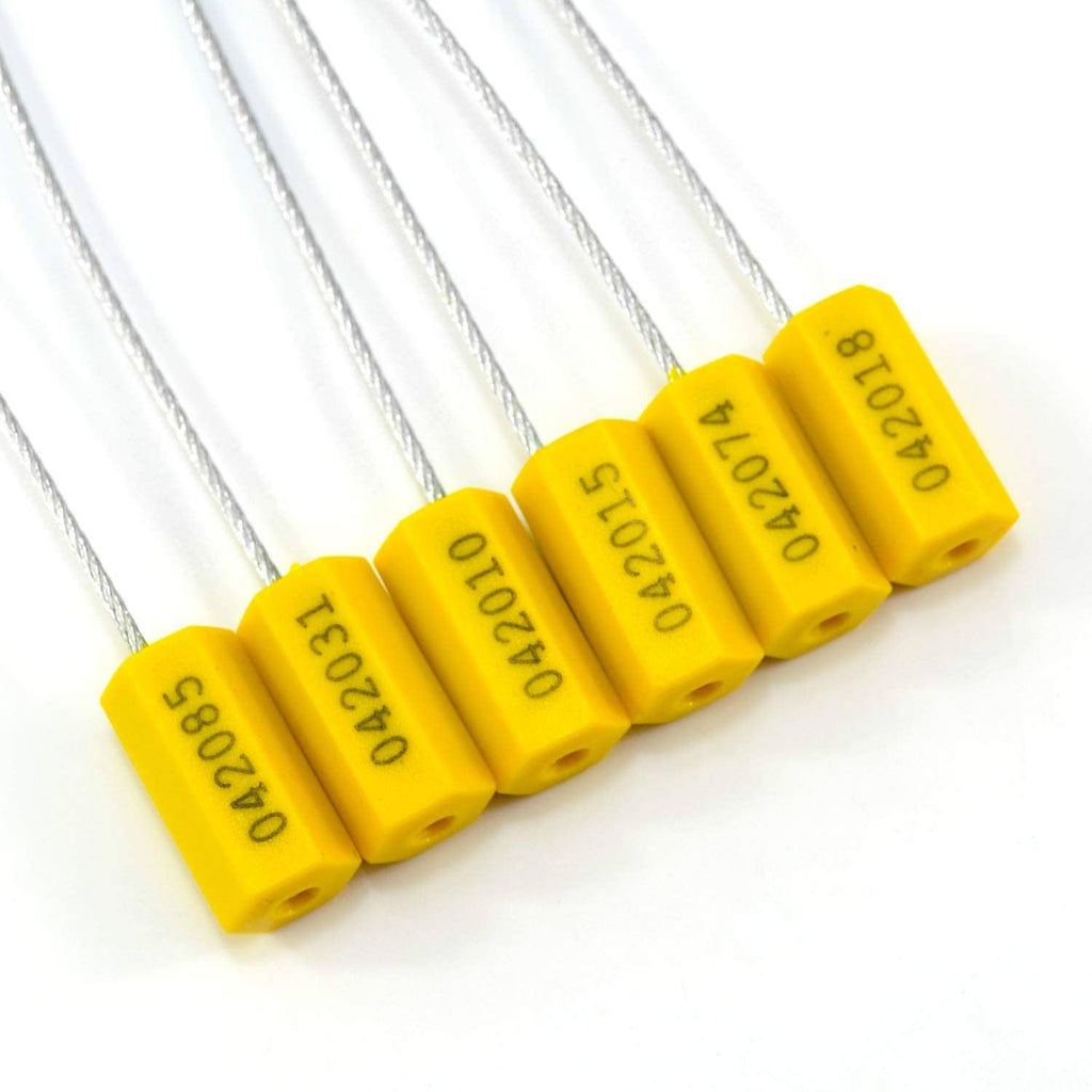Close-up of yellow cable seal blocks with steel wire and printed serial text