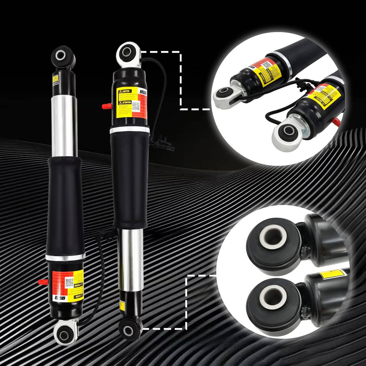 Pair of front shock struts with black coil springs and close-up bushing bracket details