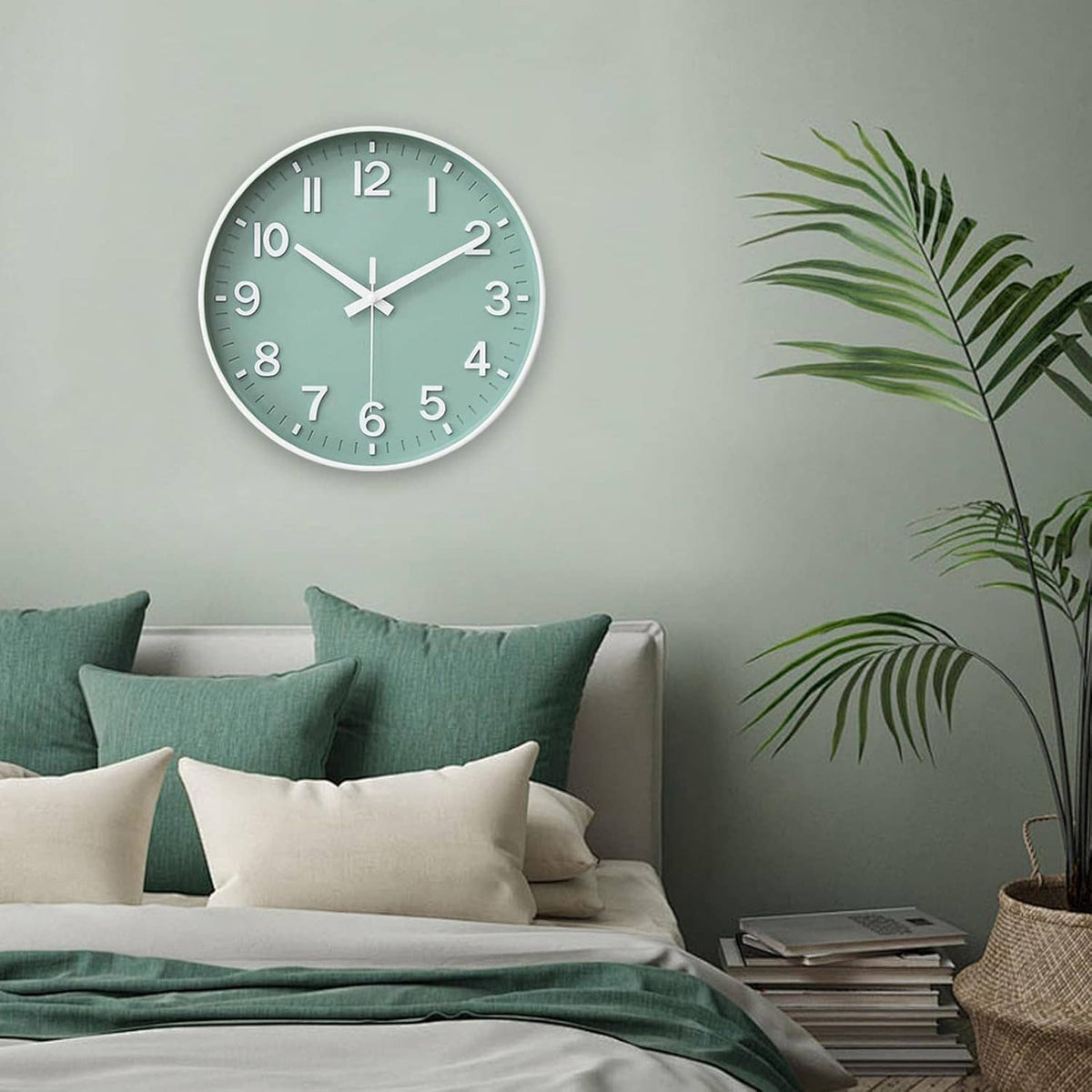 Green round wall clock with white hour markers on a wall above a sofa.