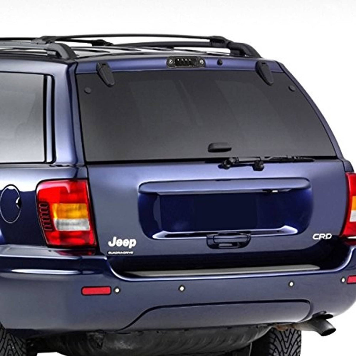 Vehicle rear with LED third brake light housing lit red on dark tailgate