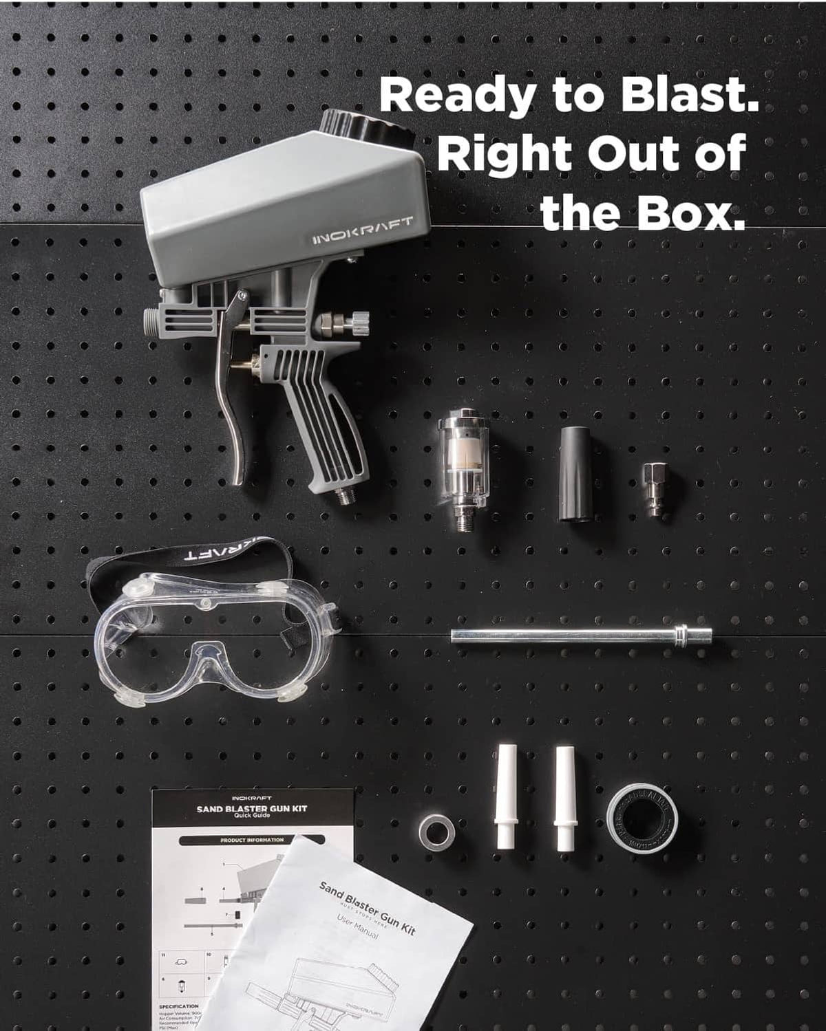Sand blaster gun kit with protective goggles, hose, and accessory parts displayed