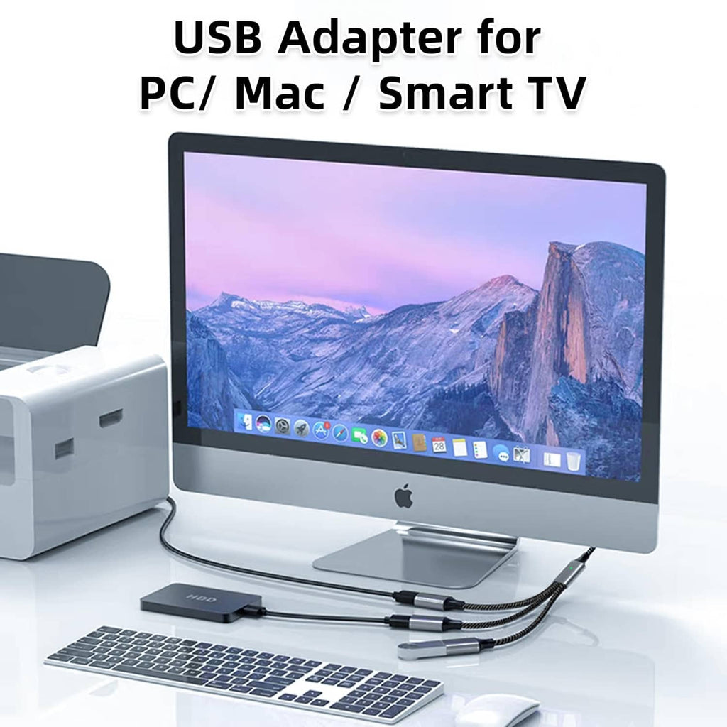 USB-C splitter cable connected to a desktop monitor with multiple USB-C outputs.