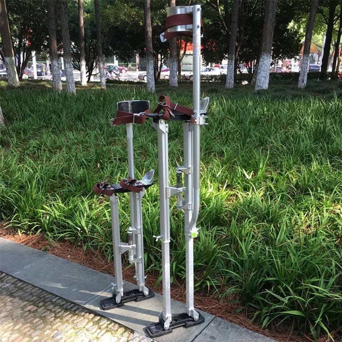 Stilt feet on ground with black anti-slip rubber pads mounted at the base
