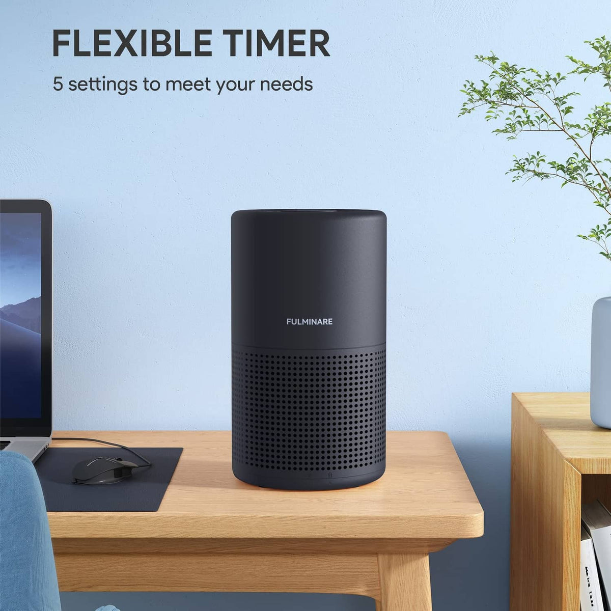 Black cylindrical FULMINARE air purifier on wooden console