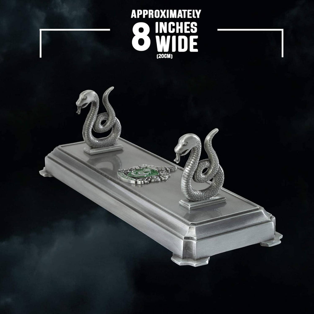 Slytherin wand stand with two silver serpents on gray base, approx 8 inches wide
