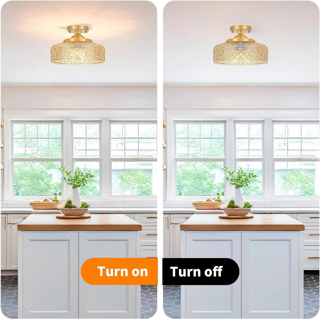 Gold semi-flush ceiling light with ornate glass shade in a bright room by windows