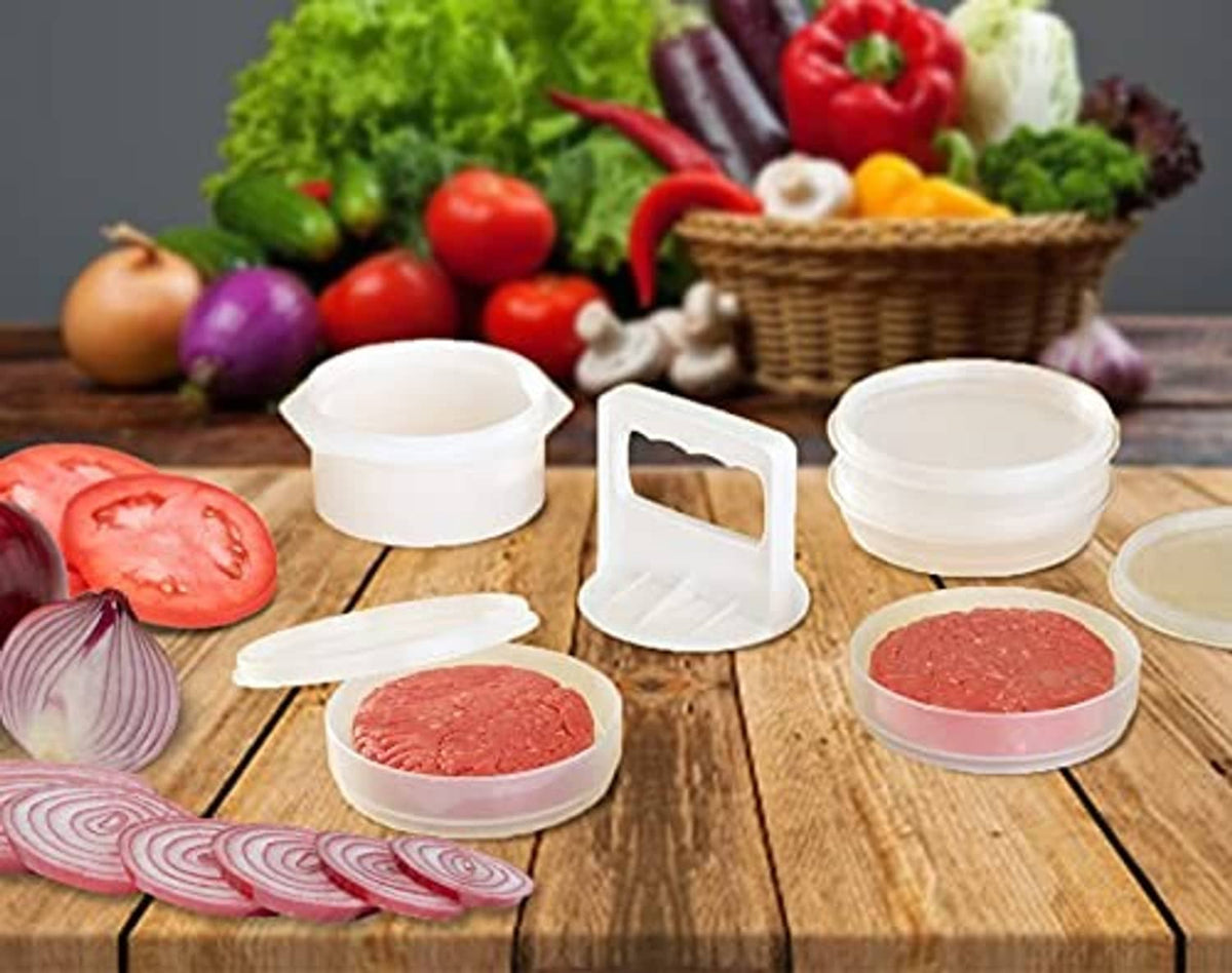 Set of white freezer containers holding raw burger patties with a small patty press