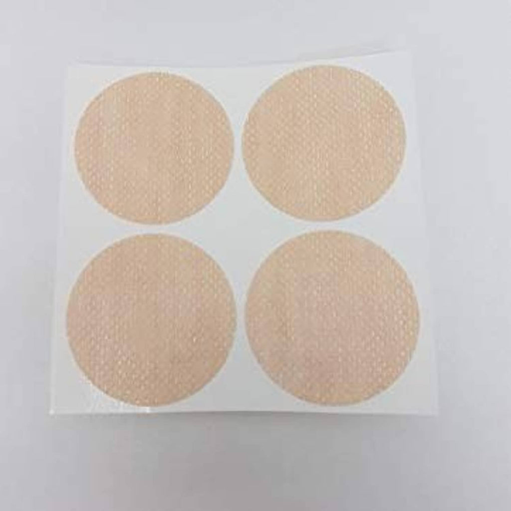 Set of four beige round adhesive nipple covers