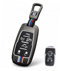 Gray metal key fob cover case with key ring, striped strap, and button icons.