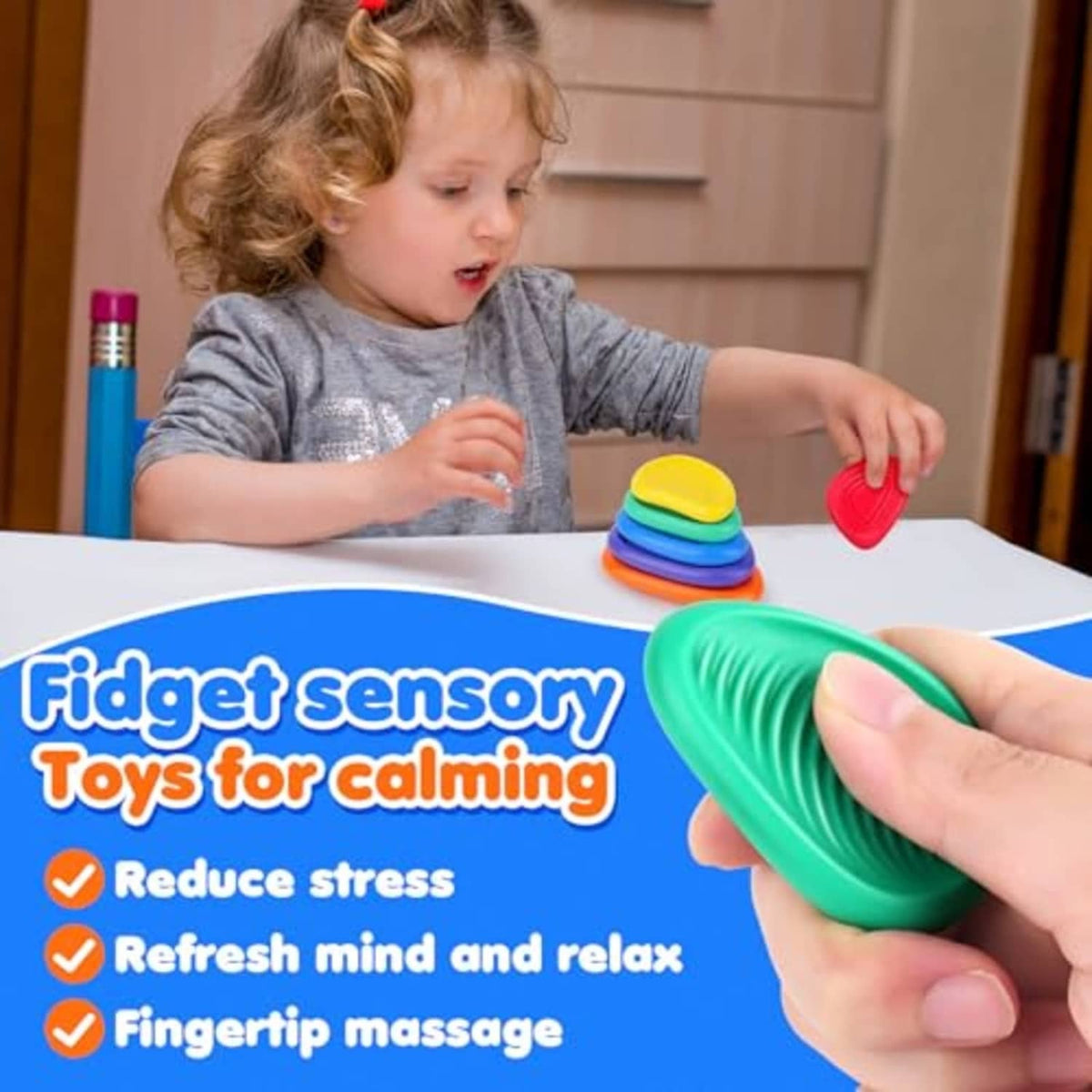 Child playing with green sensory worry stone; colorful stacked stones on tabletop