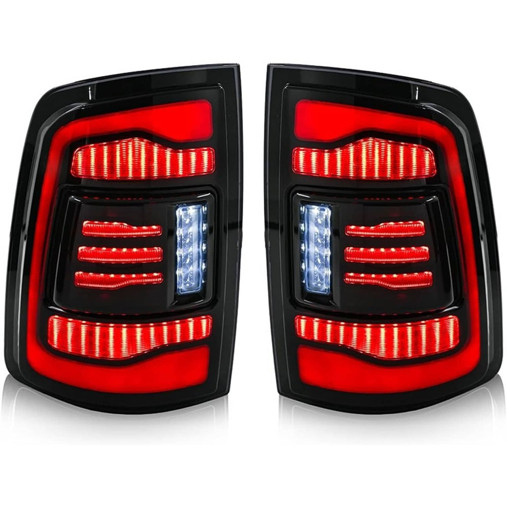 Pair of LED tail lights with red lens, amber LED bars, and clear blue reverse strip