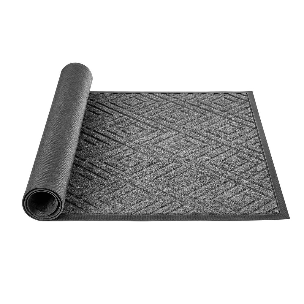 Large grey front door mat with chevron pattern, rolled for storage