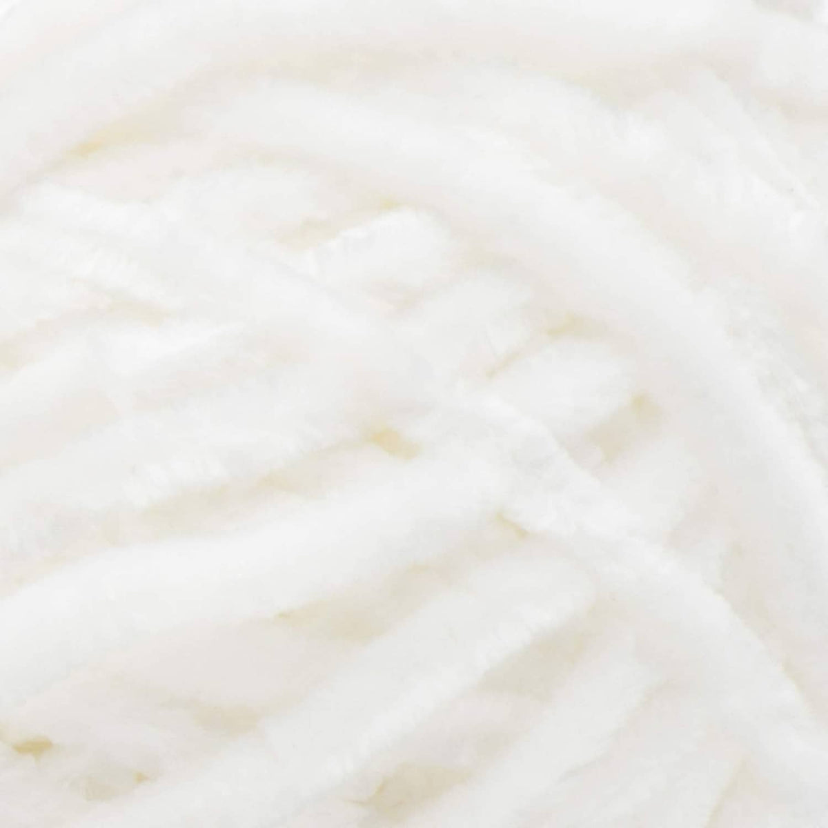 White chenille yarn texture close-up, thick super bulky loops