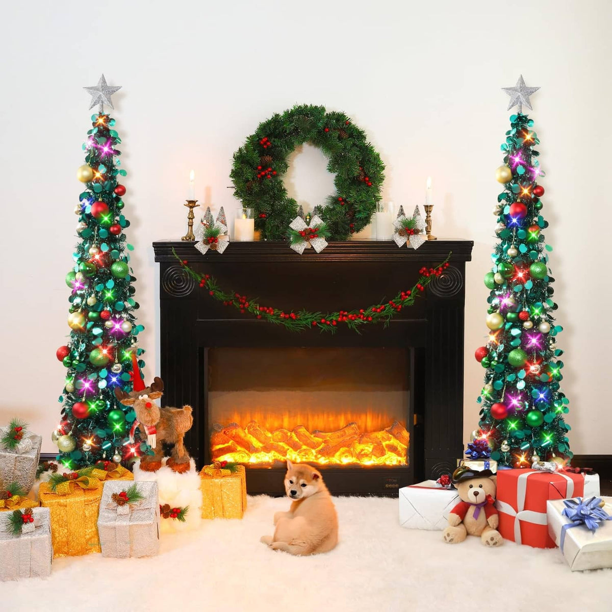 Two prelit Christmas trees with star toppers, green branches and multicolor lights flanking fireplace