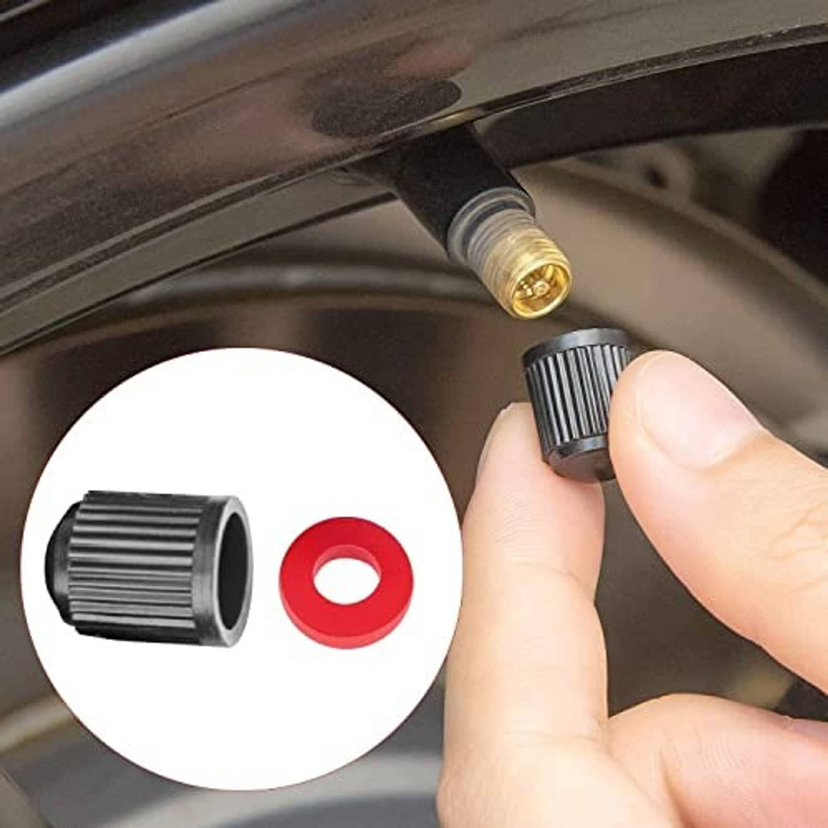 Brass valve tool and red seal being installed on a bicycle tire valve by hand