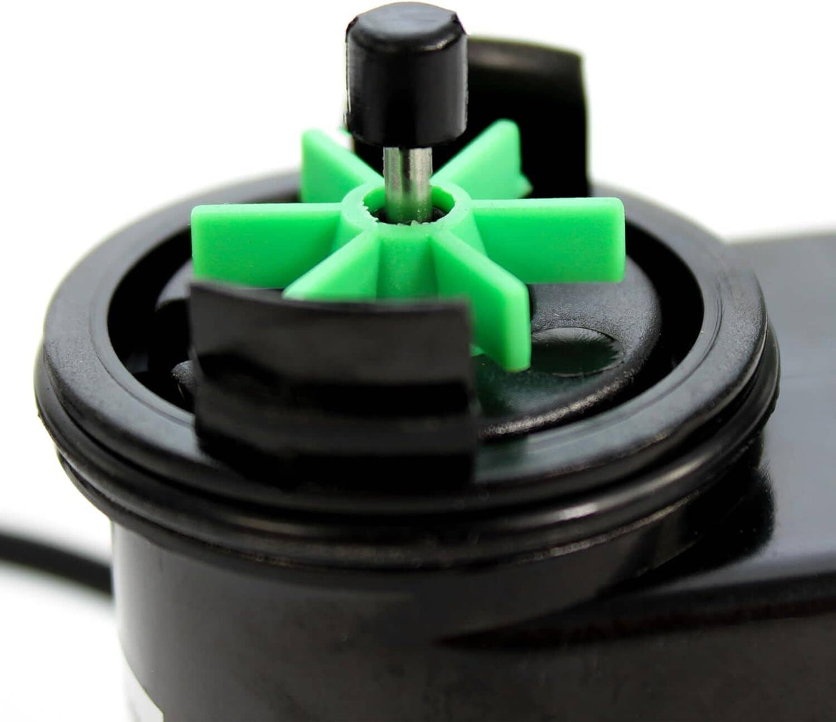Close-up of aquarium filter impeller with green cross rotor and central shaft