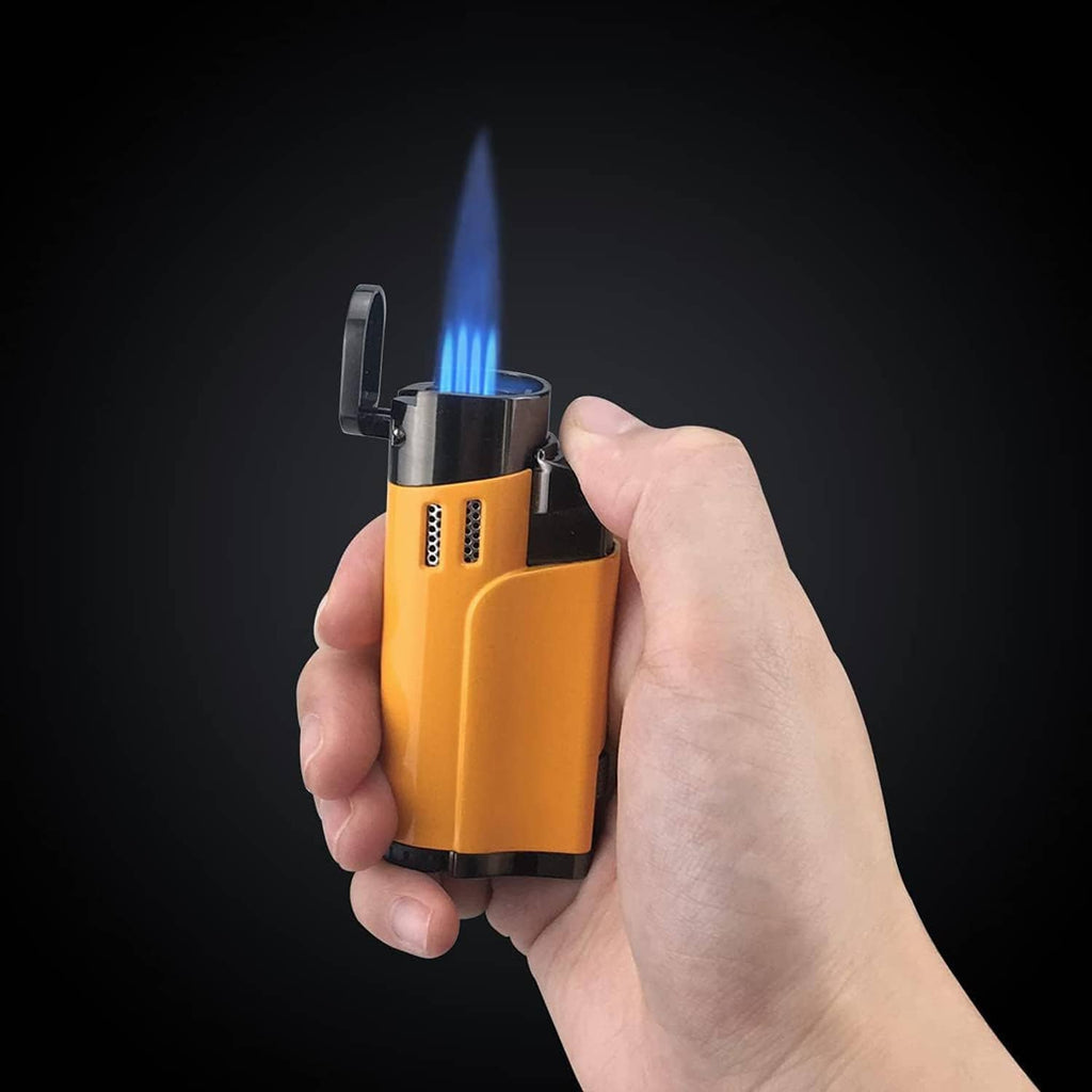 Yellow torch lighter in hand with blue flame, chrome top and black ignition wheel