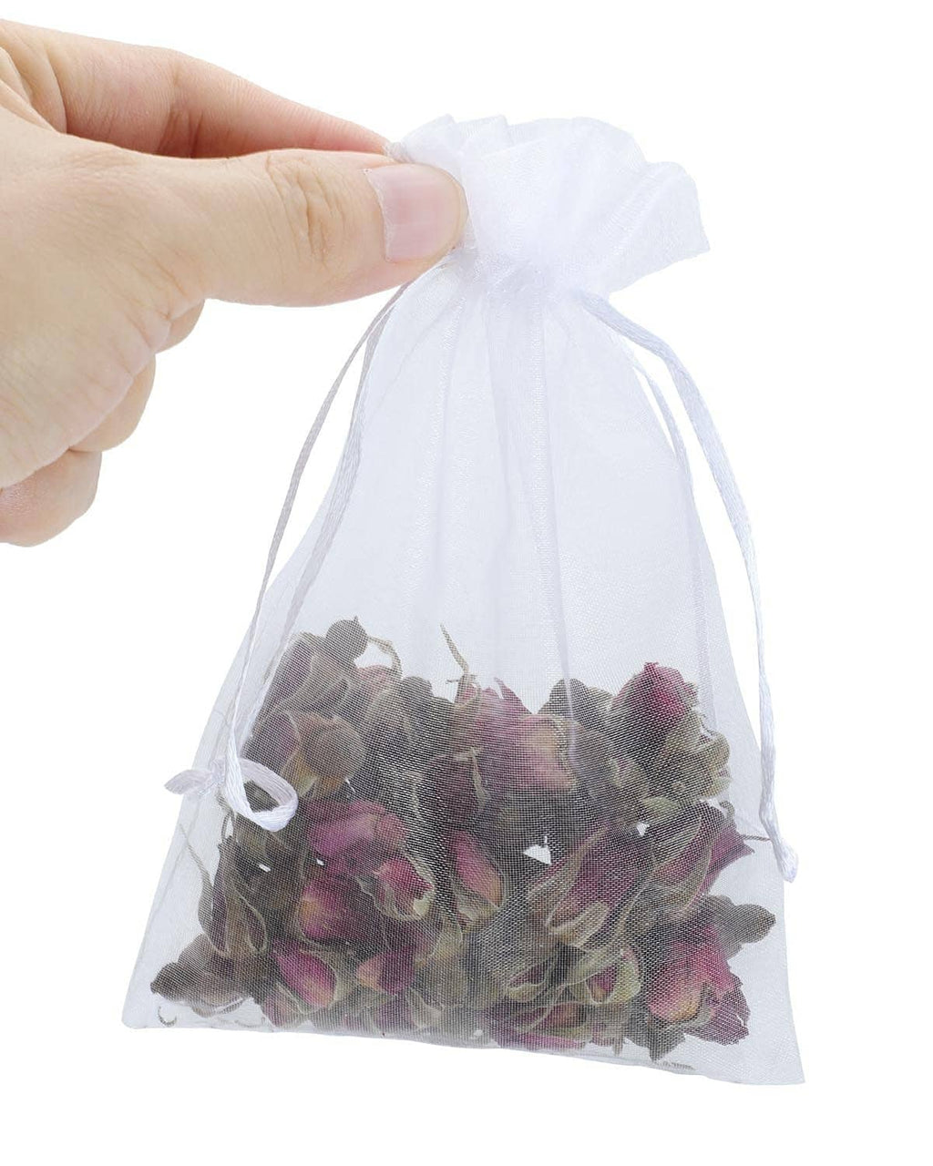 White mesh drawstring bag held in hand, filled with mixed chocolates