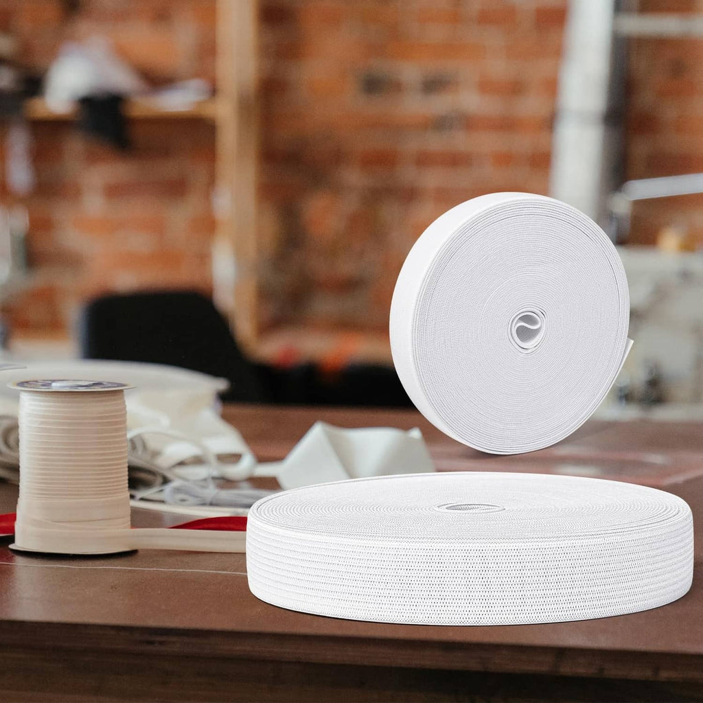 White 3/4 inch sewing elastic band on a wooden work surface