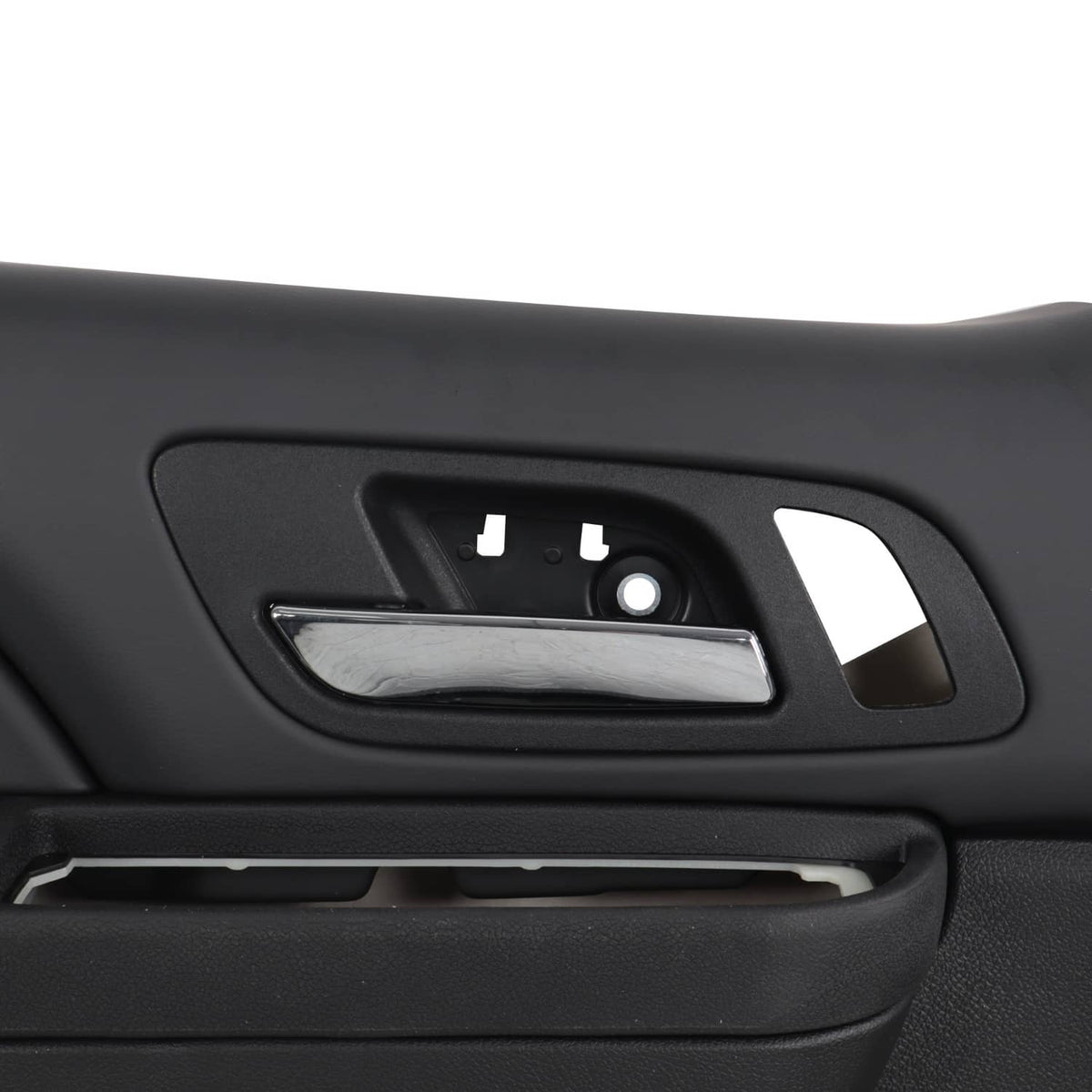Close-up of black interior door handle recess and control opening.