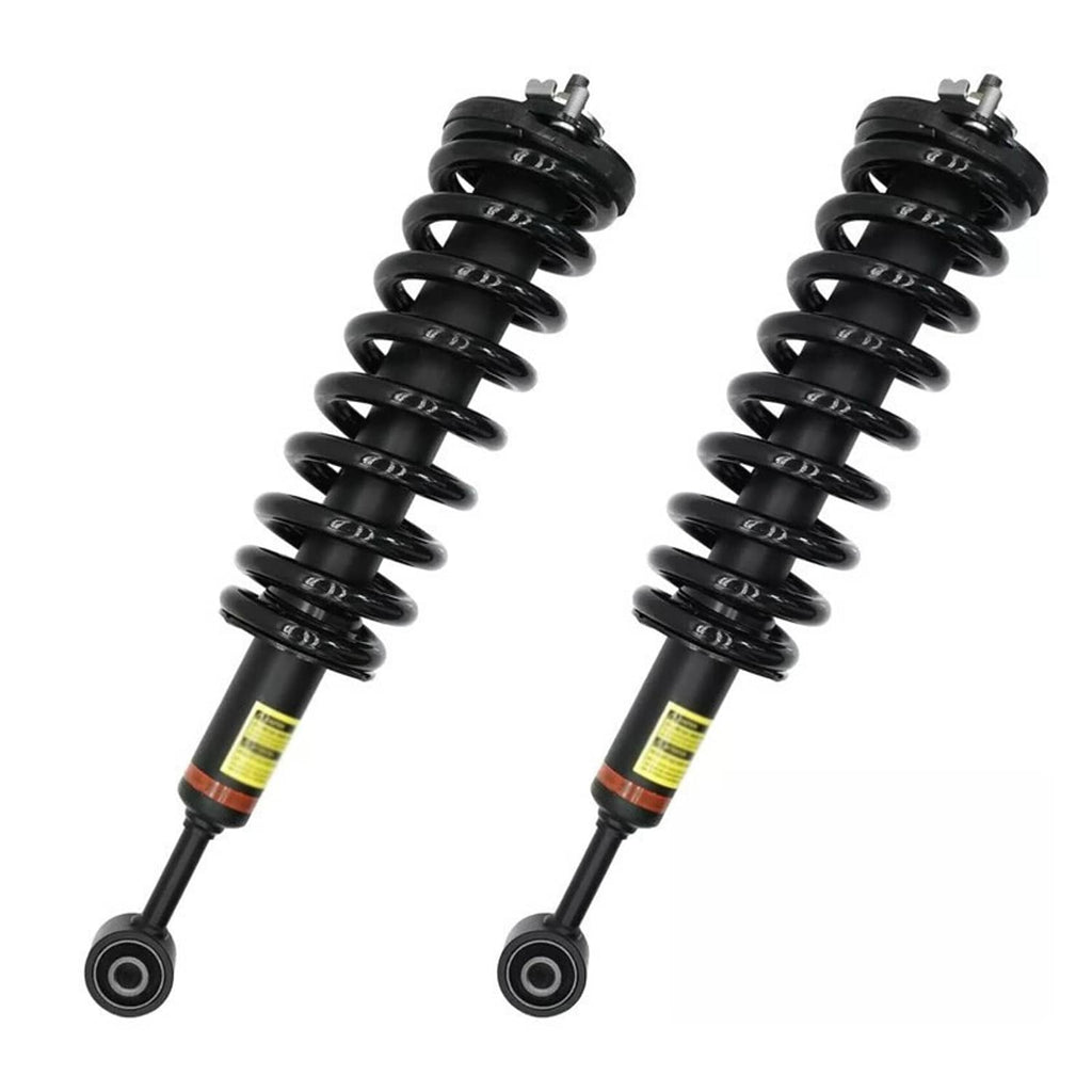 Front shock strut pair with black coil springs and piston rods, including lower arms