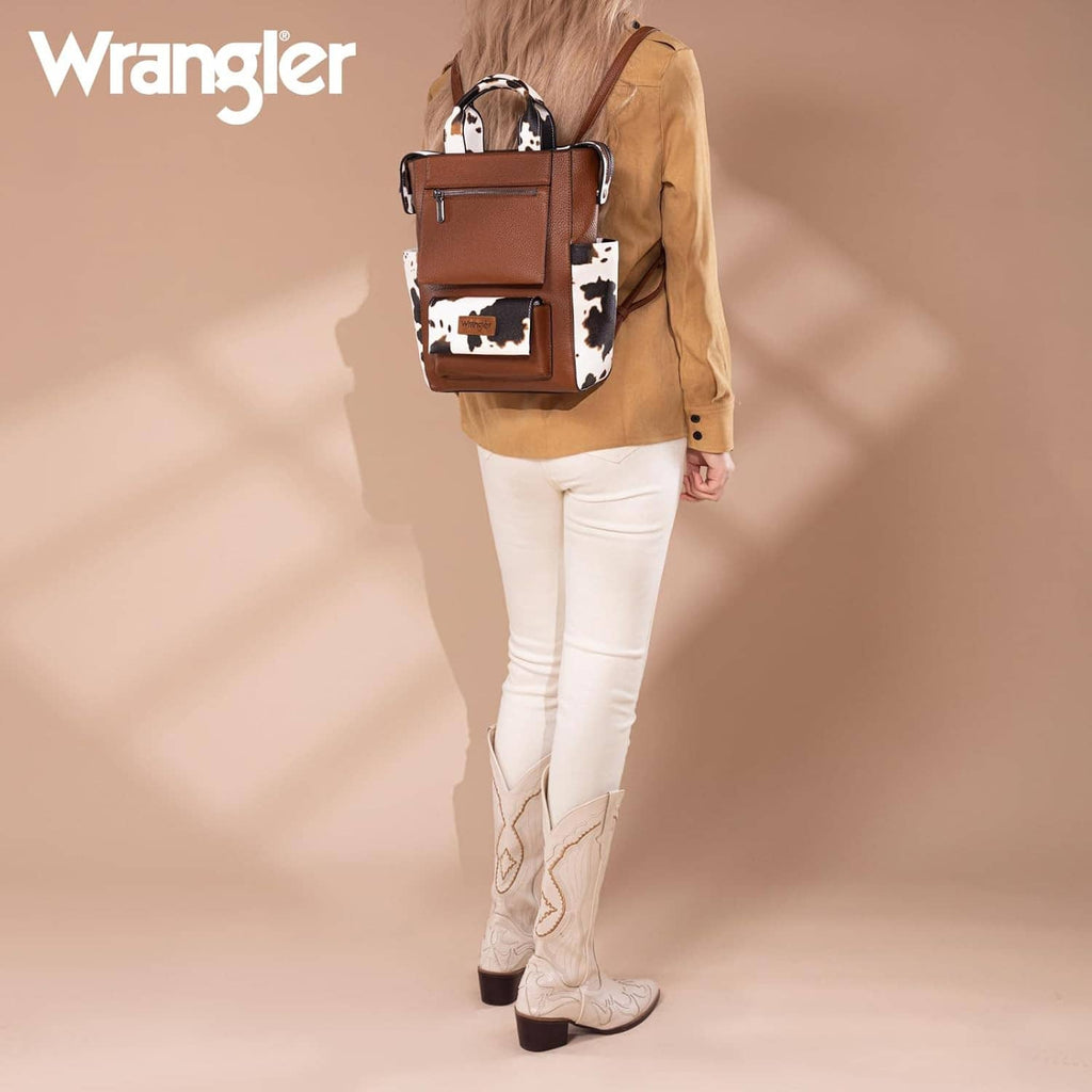 Cow-print vegan leather convertible backpack purse with front zip pocket and top handle